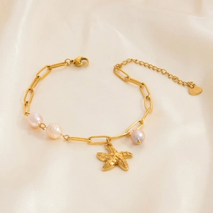 Gold stainless steel bracelet with freshwater pearls and starfish charm on beige silk