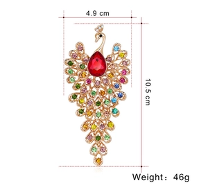 Peacock brooch dimensions showing 10.5cm length and 4.9cm width with colorful rhinestones