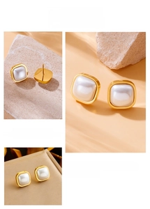 Macro detail of gold plated square stud earring featuring a lustrous white pearl inlay
