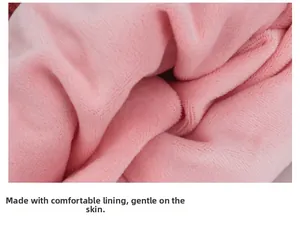 Close-up of soft pink fleece lining on a winter knit hat for babies and toddlers
