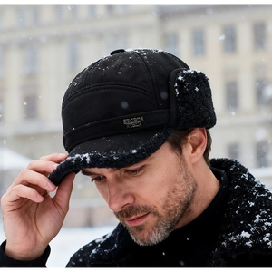 Close-up of waterproof winter trapper hat with warm fleece lining and sports logo
