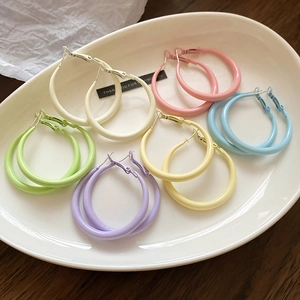 Detail of 6 pairs macaron color matte finish hoop earrings set on ceramic tray