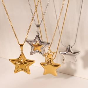 Detailed view of gold and silver star pendant necklaces with subtle diamond accents