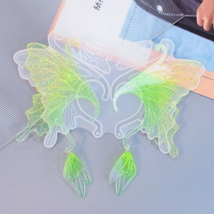 Silicone mold for butterfly wing resin ear cuffs with glittery green finish