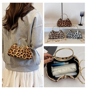 Detailed look at leopard print evening bags with gold ring handles and chain straps
