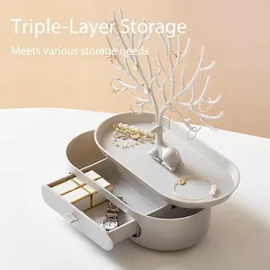 Deer antler jewelry stand with rotating drawer and tiered storage for necklaces and earrings