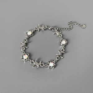Silver twisted thorn bracelet with five round moonstones and lobster clasp closure