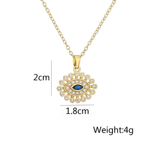 Macro detail of gold plated evil eye necklace with dimensions 2cm x 1.8cm and 4g weight