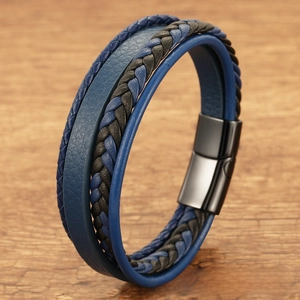 Close-up of multi-layer blue leather braided bracelet with a matte black magnetic clasp