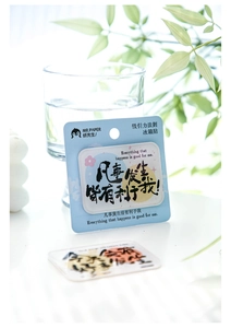 Close-up of acrylic fridge magnet with inspirational text on a bright desk
