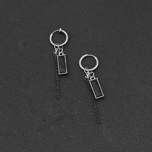 Silver fringe tassel earrings featuring a black rectangular gemstone in a punk style