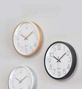 Three 12-inch quartz wall clocks in rose gold, black, and silver with minimalist white dials