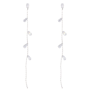 Close-up of silver tassel earrings featuring six rectangular zircon stones on chains