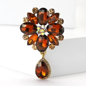Detailed view of a vintage alloy brooch with brown rhinestones and water drop glass gems