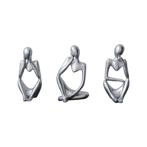 Set of three silver abstract thinker sculptures in modern minimalist resin design