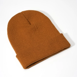 Close-up of fine knit texture and classic cuff design on a brown acrylic beanie hat