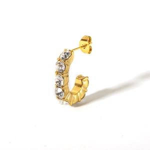 Detailed view of C-shaped 18K gold-plated earring with five sparkling zircon stones