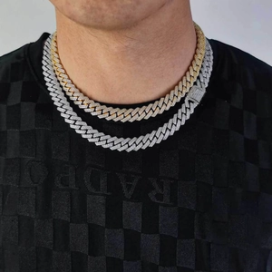 Gold and silver 12mm double-row iced out cuban link necklaces on model