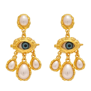 Boucles d'oreilles œil vintage avec perles blanches et cristal bleu doré