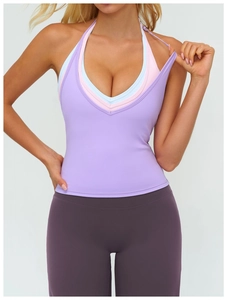 Detail of layered V-neck halter sports bra showing light blue and pink fabric layers