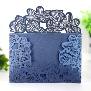 Elegant laser cut navy blue wedding invitation cover with intricate floral patterns