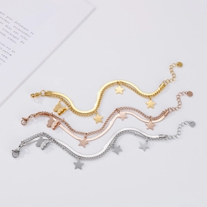 Double-layered butterfly and star charm bracelet set in gold, rose gold and silver