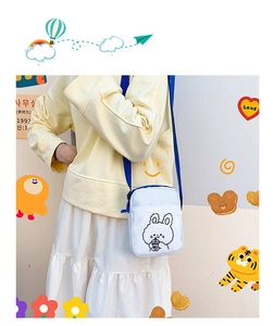 Cute white canvas crossbody bag with cartoon rabbit illustration and blue strap detail