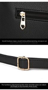 Detail of lychee pattern leather bag with golden heart zipper and adjustable shoulder strap