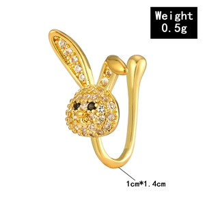 Detail shot of a golden bunny non-pierced nose cuff with white zircon stones 1cm x 1.4cm