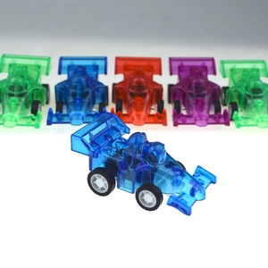 Close-up of colorful translucent formula toy cars with smooth finish and white rims
