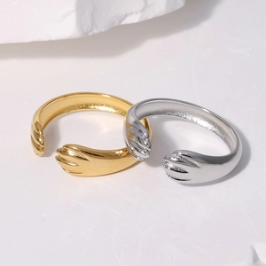 Minimalist cat paw stainless steel open rings in gold and silver set on stone