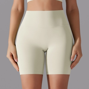 Detail of high-waist yoga shorts in cream white with seamless tummy control design