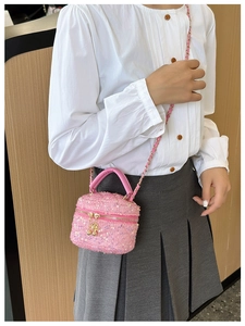 Pink sequin crossbody bag for girls with gold chain strap and cute puff ball zipper charm