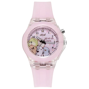 Close-up of pink luminous children's watch featuring a cartoon unicorn spinning dial