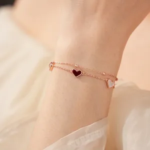 Bracelet double couche en or rose avec pendentifs cœur en nacre et émail pour femmes