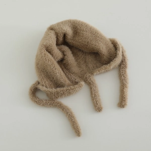 Close-up of light camel faux fur baby hat featuring cat ears and soft plush texture