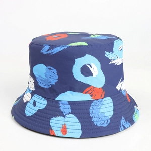 Detail of blue bucket hat featuring colorful abstract tie-dye print and wide stitched brim