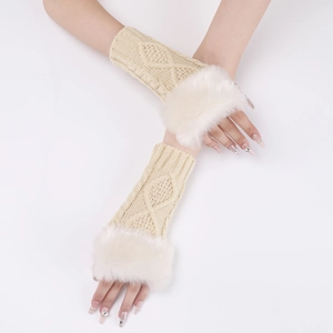 Detail of cable knit arm warmers with white faux fur trim in creamy beige color