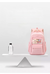 Lightweight 630g pink nylon backpack shown balancing with water on a scale