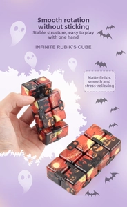Macro view of Halloween themed infinity cube with pumpkin prints for stress relief