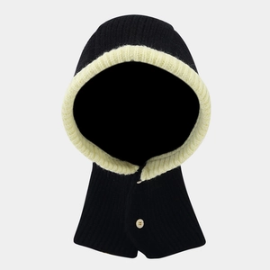 Detail of knitted black balaclava with contrast trim and decorative wooden button closure