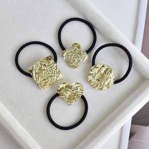 Set of 4 gold minimalist geometric hair ties with hammered metal texture for women