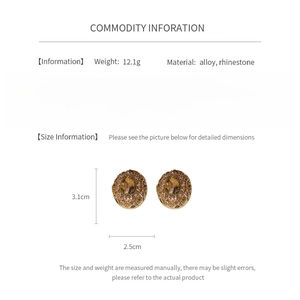 Detailed product specs of vintage oval hollow earrings with amber stones and rhinestones