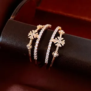 Exquisite gold-plated daisy flower cuff bracelets with shimmering zircon stones