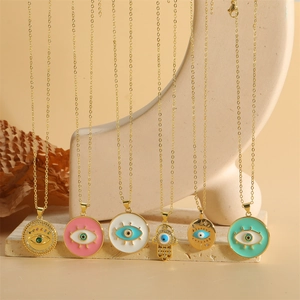 Hamsa Hand and Evil Eye pendant necklaces in multi-color enamel with gold chains