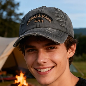 Outdoor vintage distressed dark grey baseball cap with mountain embroidery on model