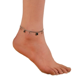 Silver chain anklet with minimalist round shell pendants on female model wearing high heels