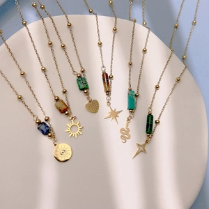Bohemian gold beaded necklaces with natural stone pendants and celestial metal charms