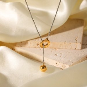 Two-tone stainless steel Y-necklace with gold hoop and ball pendant on silver chain