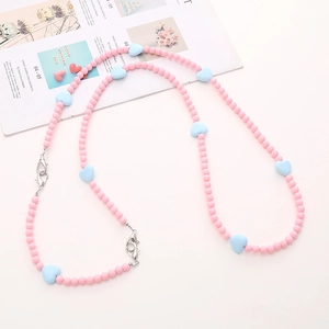 Detail of pink round and light blue heart acrylic beads with silver lobster clasps lanyard